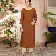 Laxmipati Bombay Velvet Cinamon Brown Straight Kurti Have Fancy Necklines With All Over Grading Embossed Buttas   & Laces Use Of Contrast Colour Effect, Along With Pant