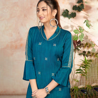 Laxmipati Bombay Velvet Whale Blue Straight Kurti Have Fancy Necklines With All Over Grading Embossed Buttas   & Laces Use Of Contrast Colour Effect, Along With Pant