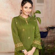 Laxmipati Bombay Velvet Leaf Green Straight Kurti Have Fancy Necklines With All Over Grading Embossed Buttas   & Laces Use Of Contrast Colour Effect, Along With Pant