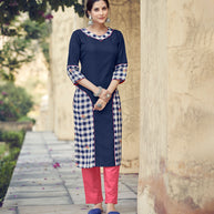 Laxmipati Rayon Cross And Swiss Slub Navy Blue And White Blue Checks Kurti With Two Fabrics By Giving All Over Grading Butta With Different Princess Lines , Fancy Yoke , Classy Necklines And Sleeve With Comfy Cuff.