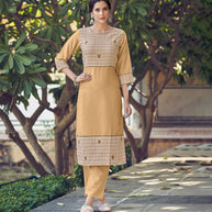 Laxmipati Rayon Cross And Swiss Slub Beige And Natural Beige Checks Kurti With Two Fabrics By Giving All Over Grading Butta With Different Princess Lines , Fancy Yoke , Classy Necklines And Sleeve With Comfy Cuff.