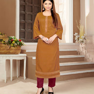 Laxmipati Rayon Cross Caramel Beautifully Placed Embroidered Boarder Straightfit Kurti With Evergreen Necklines, Enhancing With Stylish Button .