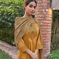 Laxmipati Muslin Majestique Musturd Flaired Length Gown With Dupatta