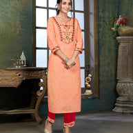 Laxmipati Cotton Polo Flex   Melon Orange Classy Straight Kurti With Simple Neck , While The Embroidery Detailed Bodice And Trims Add A Traditional Finishing Touch. Along With Pant