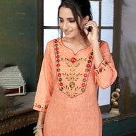 Laxmipati Cotton Polo Flex   Melon Orange Classy Straight Kurti With Simple Neck , While The Embroidery Detailed Bodice And Trims Add A Traditional Finishing Touch. Along With Pant